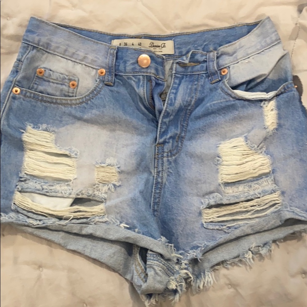Ripped blue shorts